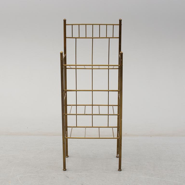 A brass shelf and two flutes, 20th century.