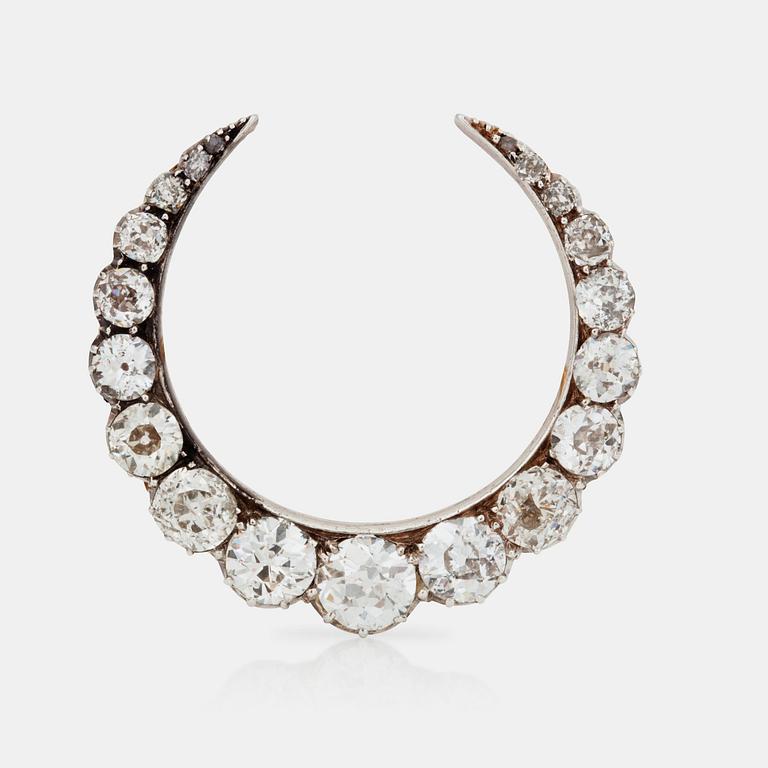 A Victorian crescent brooch set with old-cut diamonds, total carat weight circa 3.95 cts.