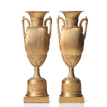 A pair of Empire-style urns, late 19th century.