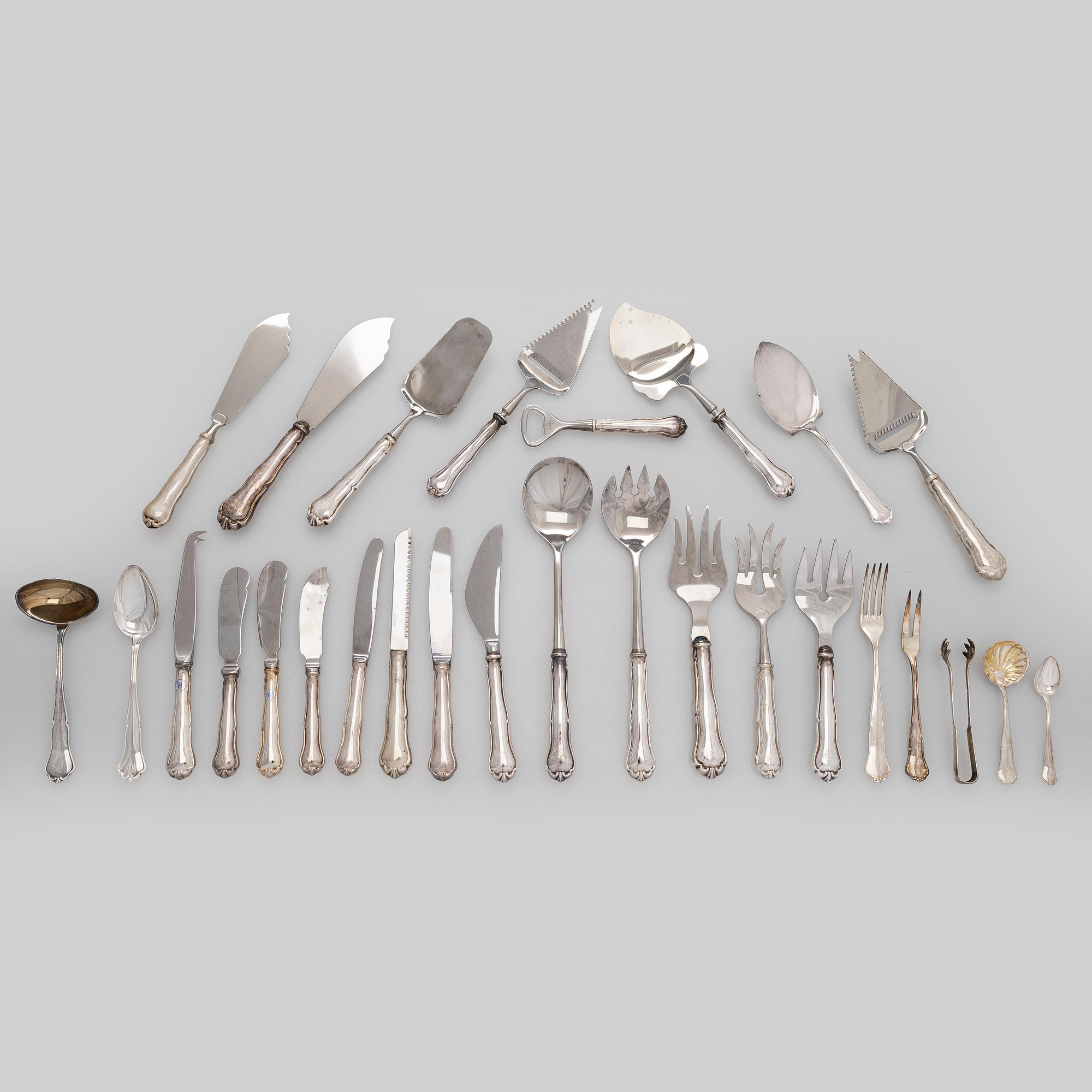 An 56-piece set of 'Chippendale' silver cutlery, Finnish hallmarks.