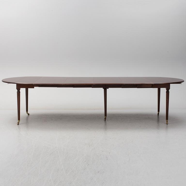 A mid 20th century mahogany veneered dining table by AB Harald Westerberg, Stockholm.