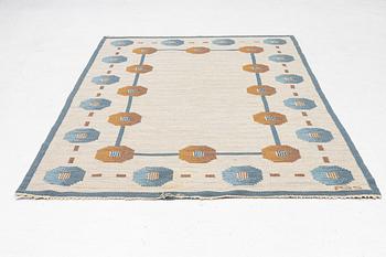 A flat weave carpet by Anna-Greta Sjöqvist c 223 x 144 cm, signed AGS.