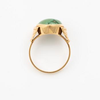 18K gold ring with green stone.