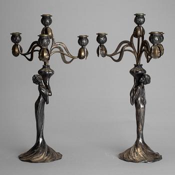 A pair of art noveau chandeliers by WÜRTEMBERGISCHE METALLWAREN FABRIK (WMF), Germany.