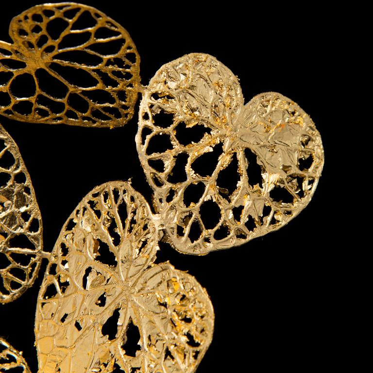 A MARIA JAUHIAINEN BROOCH, "cloud of Hearts", steel, 24K gold leaf, 2018.