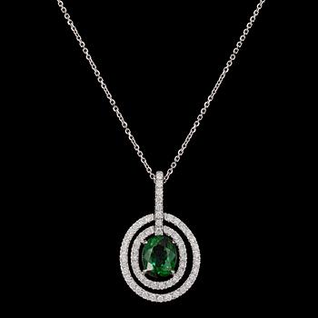 187. PENDANT, oval cut green tourmaline and brilliant cut diamonds, tot. 0.53 cts.