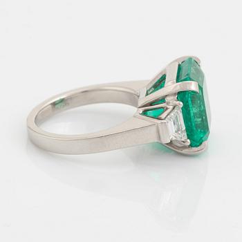 Emerald and trapezoid cut diamond ring.