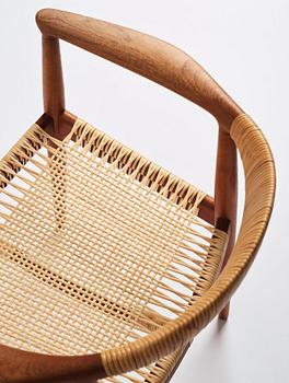Hans J. Wegner, a pair of teak and rattan 'The Chair', JH-503, Johannes Hansen, Denmark 1950s.