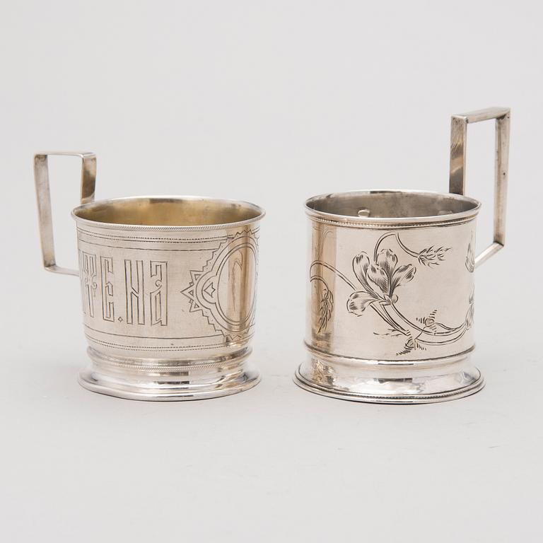 Two tea glass holders in silver, one with mark of Ivan Saltykov, Moscow 1889, the other one marked Moscow 1908-1917.