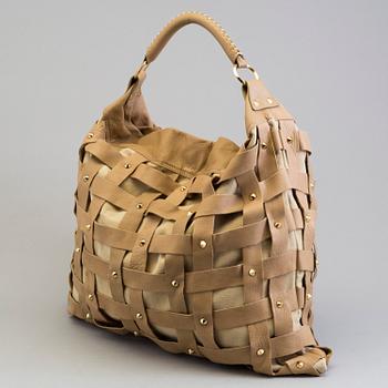 A Salar Juni Woven Shoulder Bag.