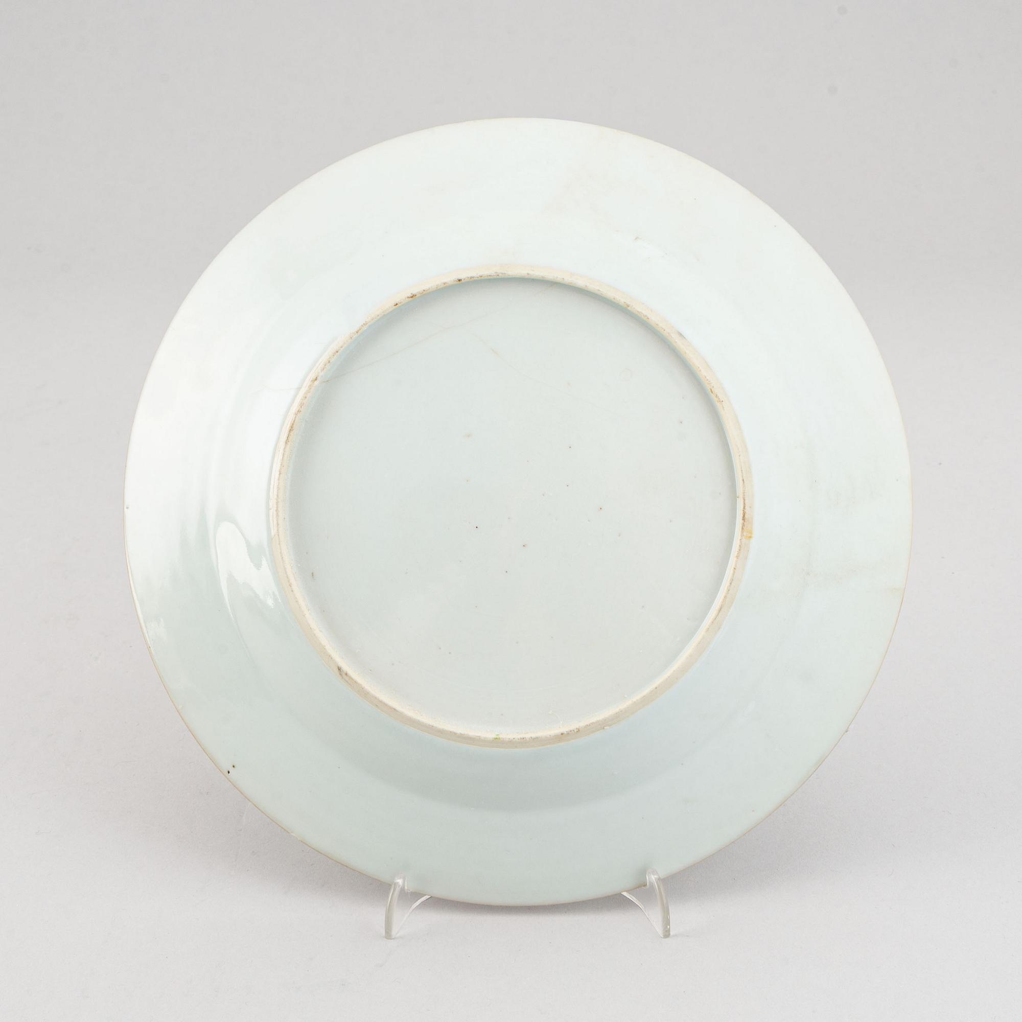 A set of two blue and white serving dishes, and two famille rose dinner plates, Qing dynasty, Qianlong (1736-95).