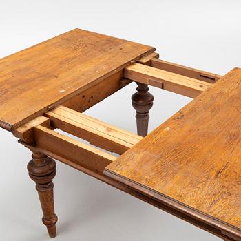 A dining table, late 19th Century.