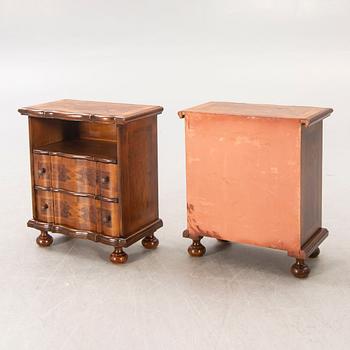 A pair of walnut and mahogany Baroque style b edside tables later part of the 20th century.