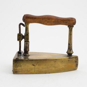 A set of four Swedish brass irons, 18th/19th Century.