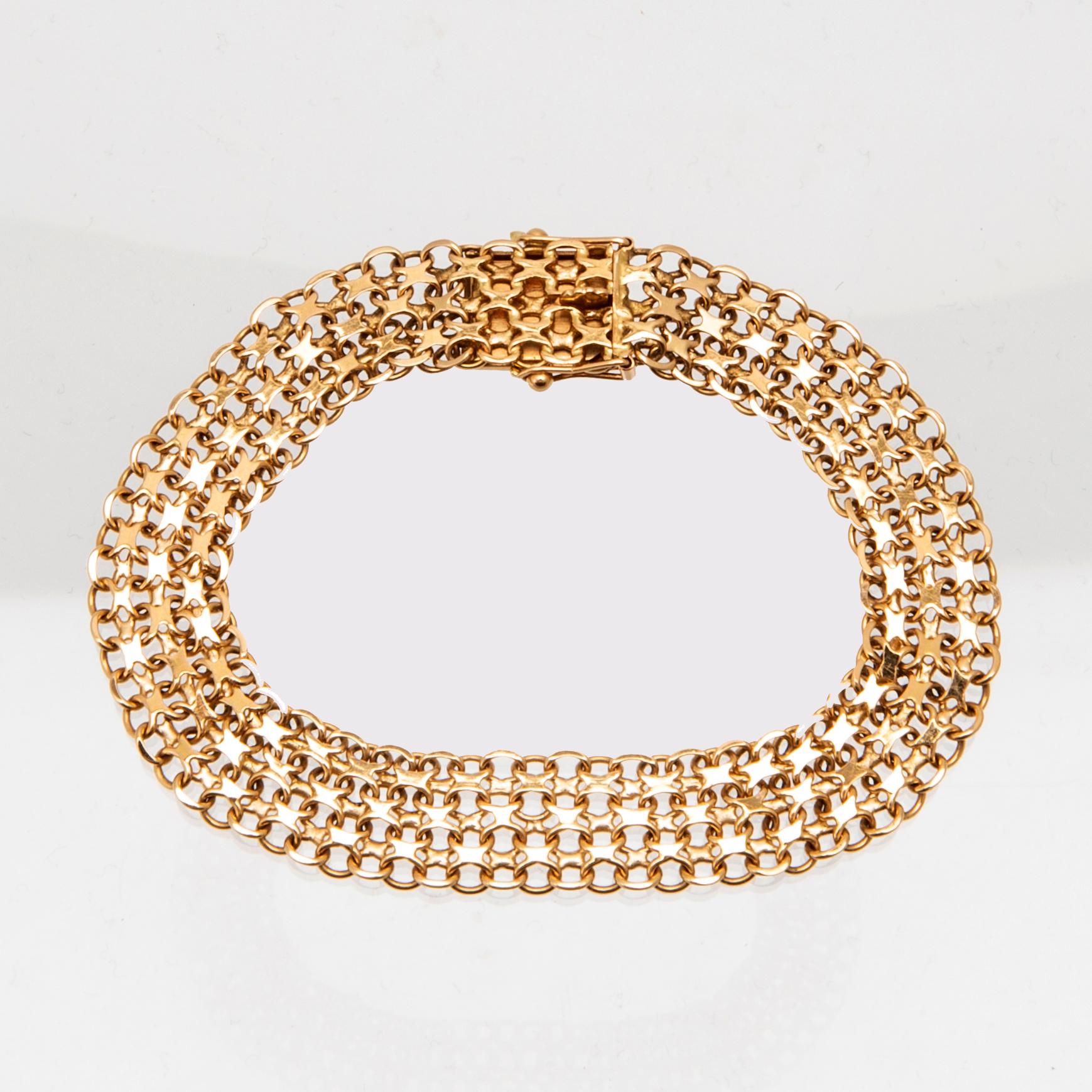 An 18K gold x-link bracelet.