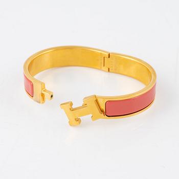 Hermès, a 'Clic H PM' bracelet.