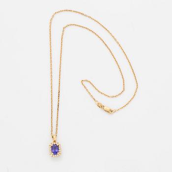 An 18K gold necklace set with a faceted tanzanite.