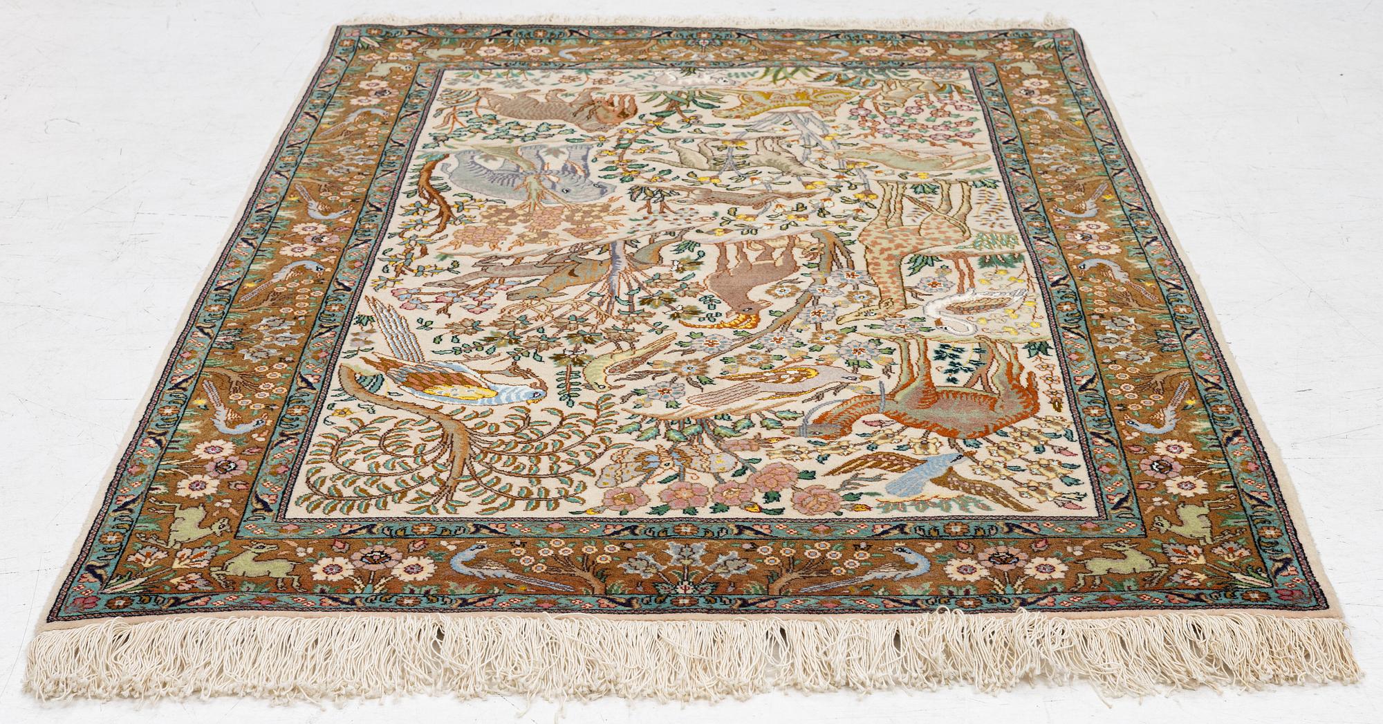 A Tabriz part silk rug, c. 145 x 100 cm.