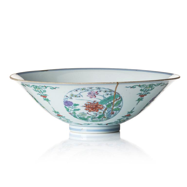 A doucai 'floral' bowl, Qing dynasty, Yongzheng mark and of the period (1723-35).