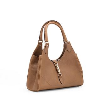 623. GUCCI, a dark beige leather handbag.