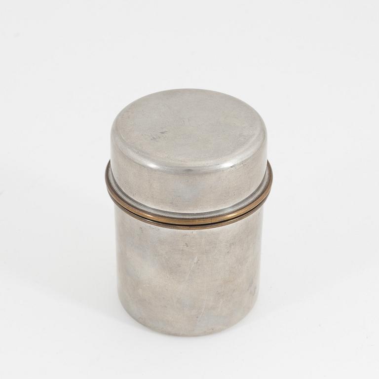 Estrid Ericson, A pewter and brass jar with cover, Firma Svenskt Tenn, Stockholm, 1957.