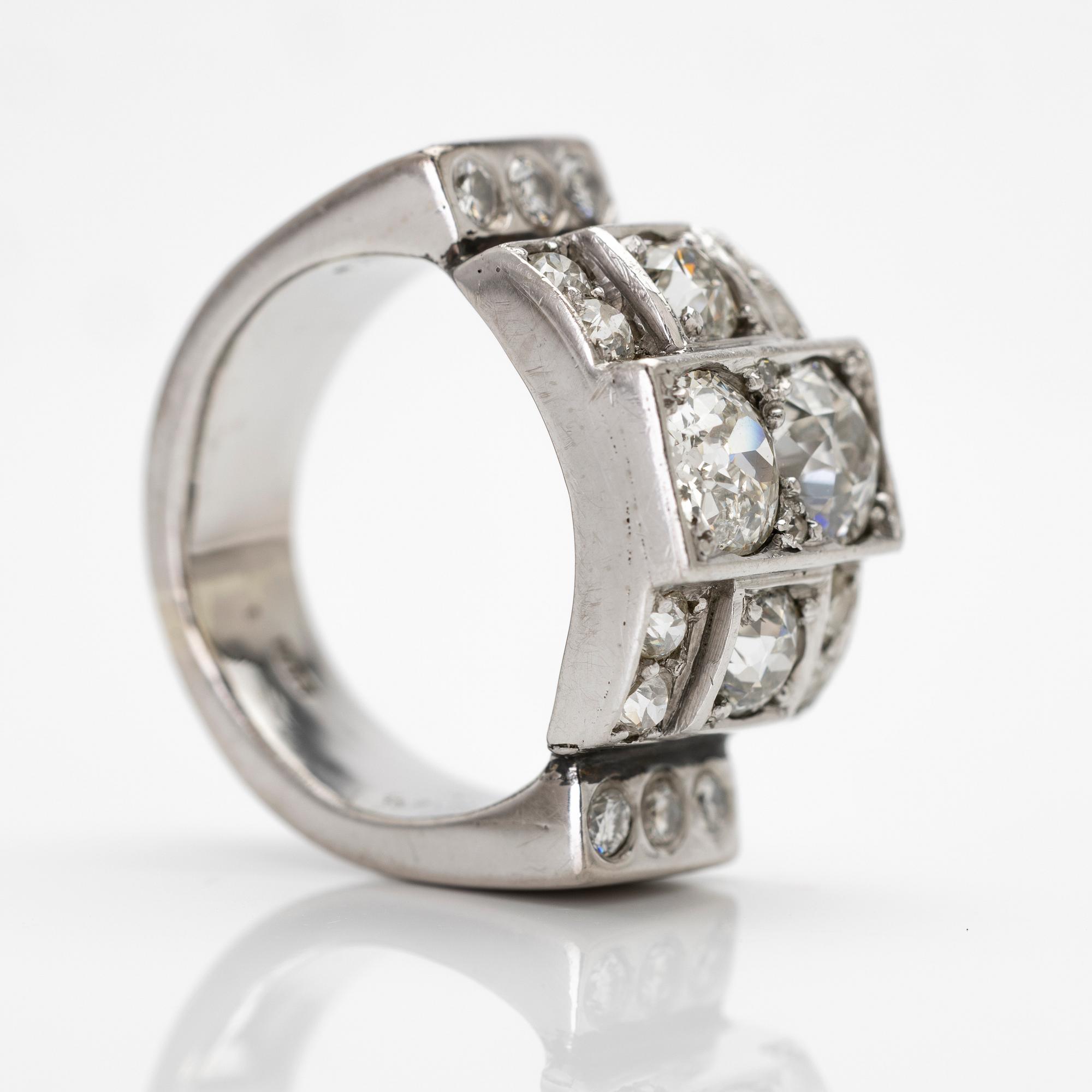 18K white gold ring with diamonds.