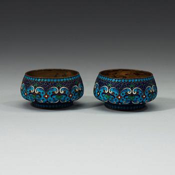 A pair of Russian early 20th century silver-gilt and enamel salts, unidentified makers mark, Moscow 1899-1908.