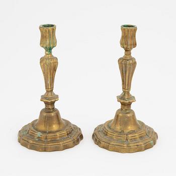 A pair of French brass candles sticks, 19th Century.