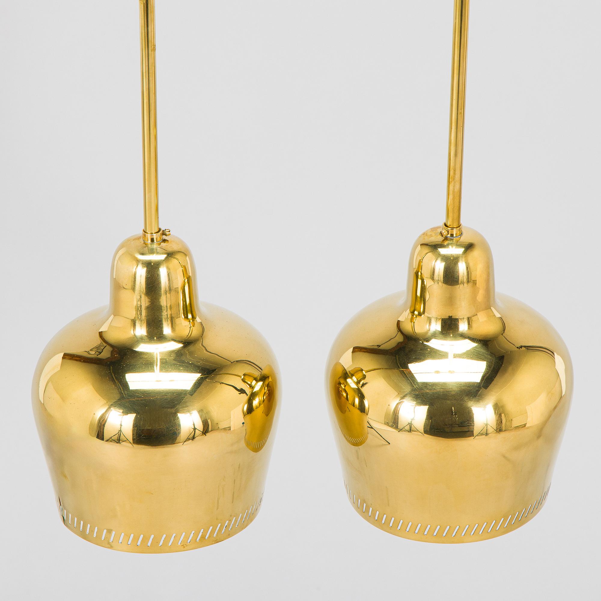 Paavo Tynell, a pair of mid 20th century ceiling lights, model 1699, for Taito / Idman.