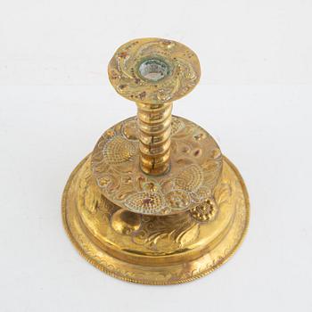 A Swedish repousse-brass baroque candlestick, circa 1700.