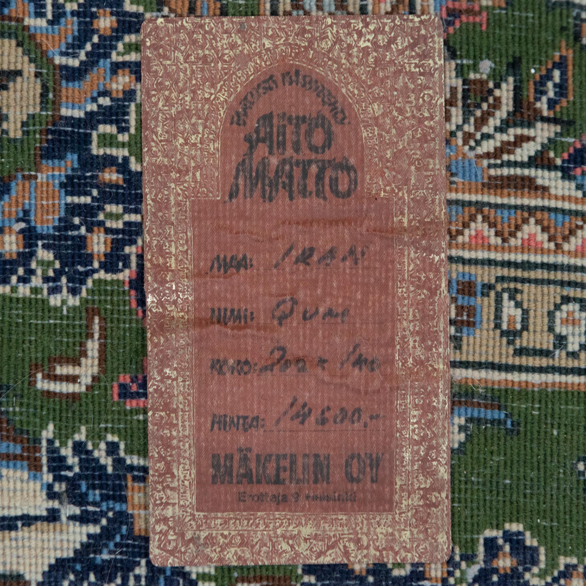 An oriental carpet. Qum. Circa 201x140 cm.