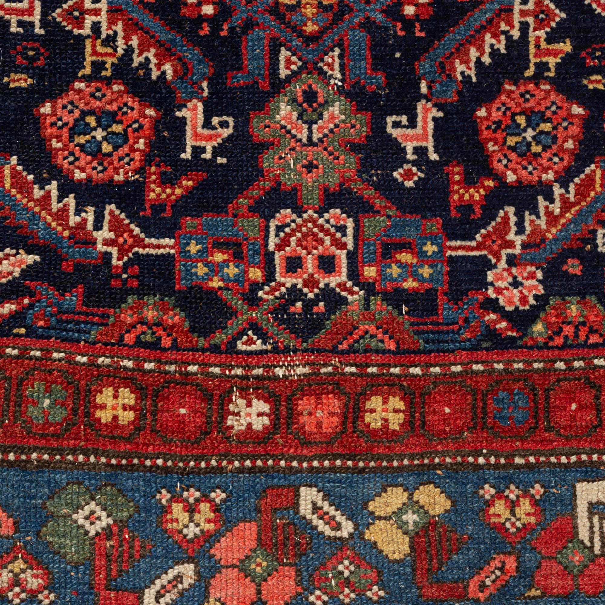 A carpet, semi-antique kurdish, circa 300 x 147 cm.