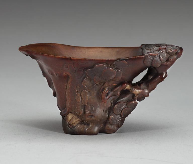 A rhinoceros libation cup, Qing dynasty, ca 1700.