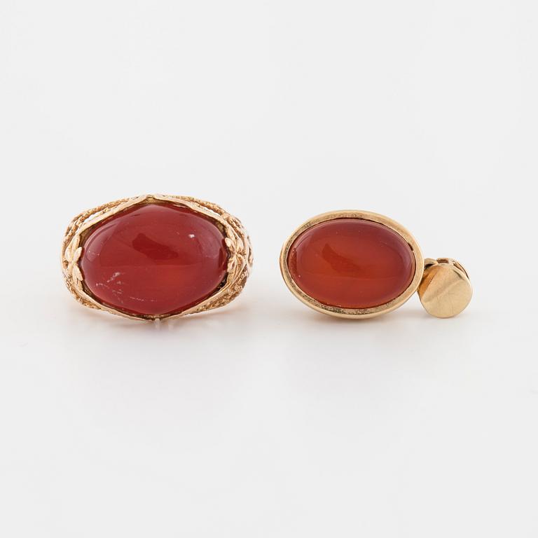 A cabochon cut carnelian ring and brooch.