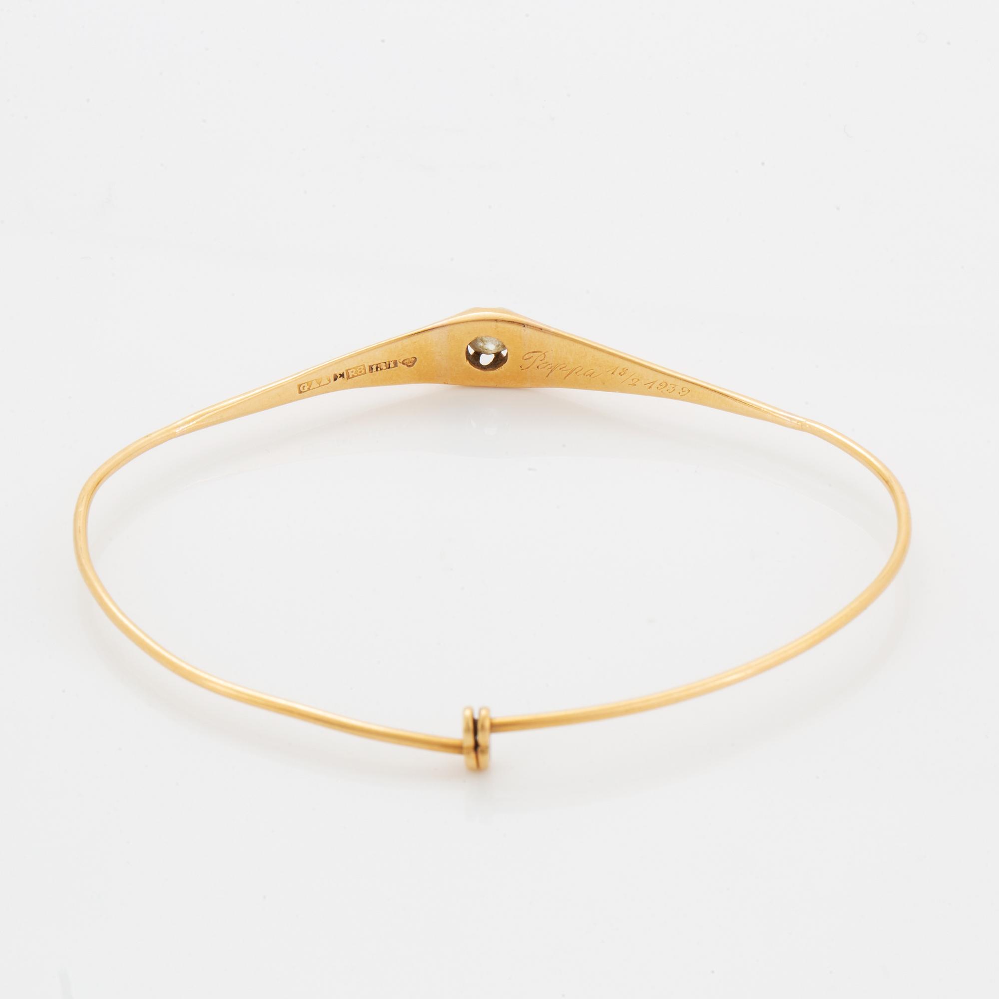 ARMRING, guld med gammalslipad diamant.