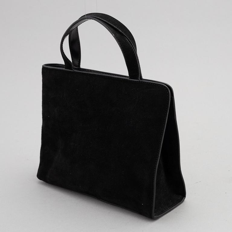 Gucci, a black suede handbag.