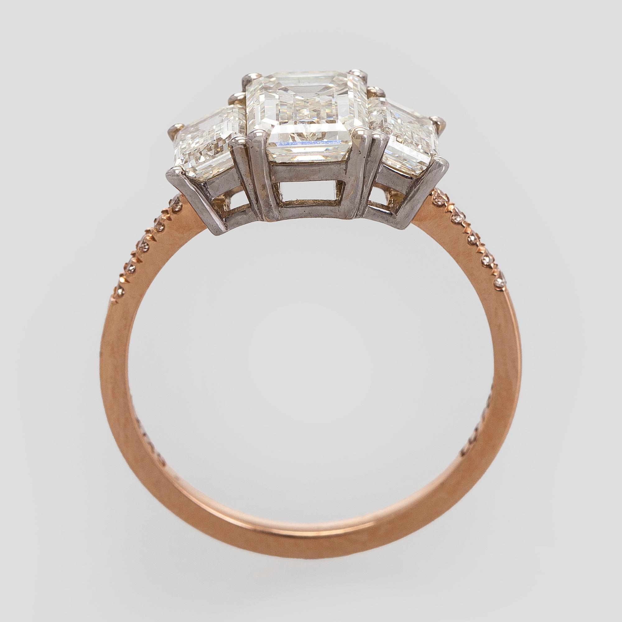 Ring, three baguette cut diamonds, small brilliant cut diamonds, 18K white gold and rose gold.