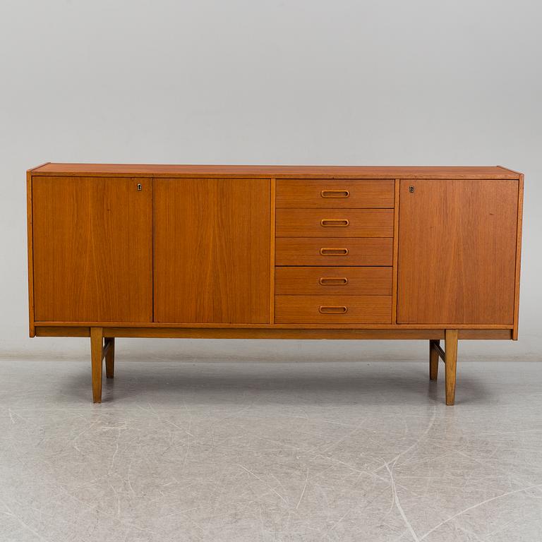 A 1960's teak vaneered sideboard.