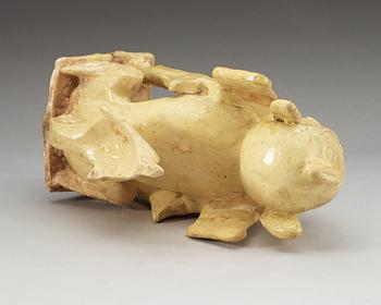 A yellow glazed pottery guardian, Tang dynasty (618-907).