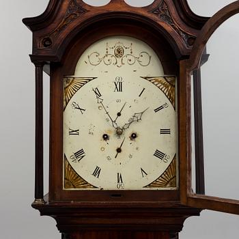 A first half of the 19th century mahogany long case clock.