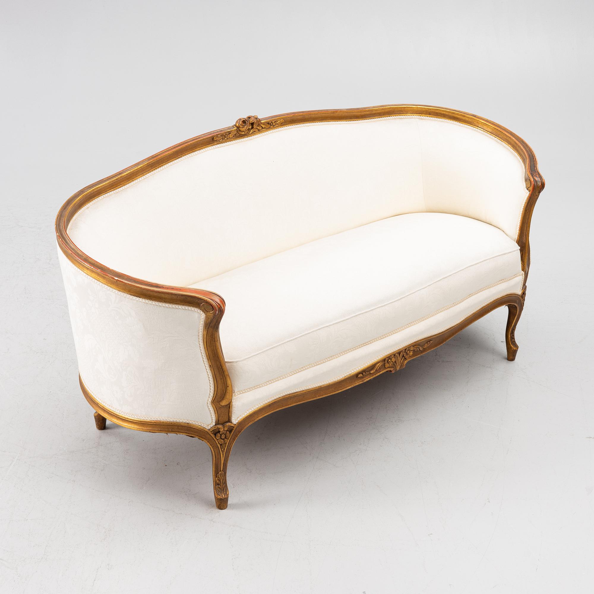 A Louis XV-style sofa, early 20th century.