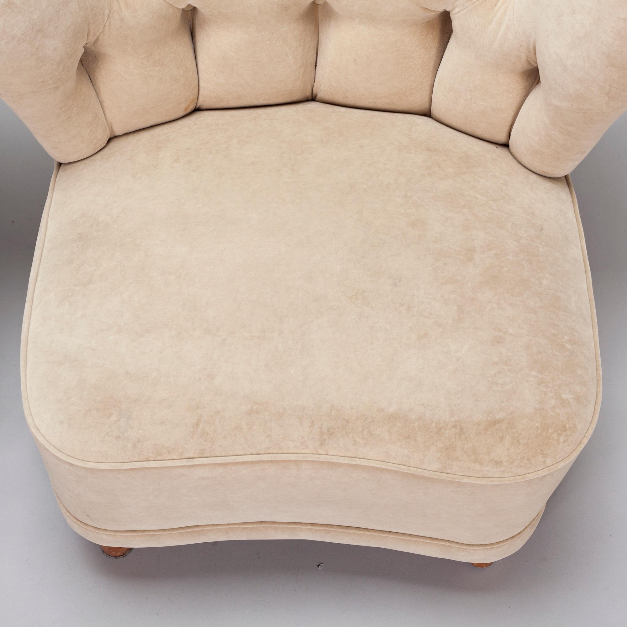A pair of mid-20th century armchairs.
