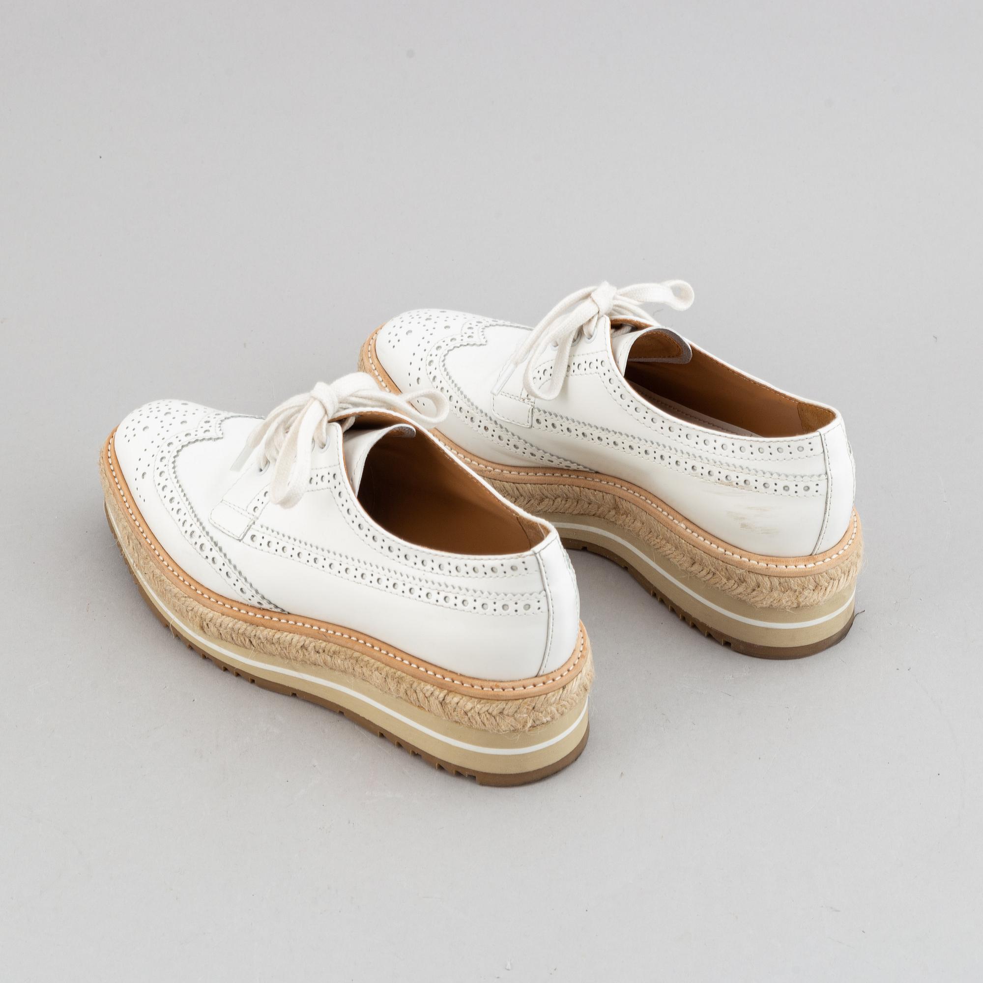 Prada, a pair of white leather brogues, size 36.