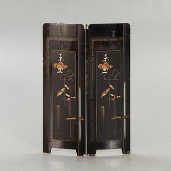 An early 1900s fire screen.