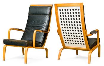 A pair of Carl-Axel Acking armchairs in beech and white lacquered plywood, upholstered in black leather by DUX ca1949-51.