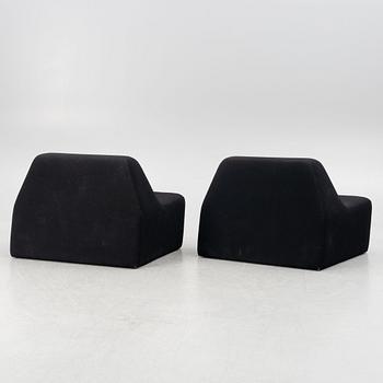 A pair of contemporary lounge chairs.