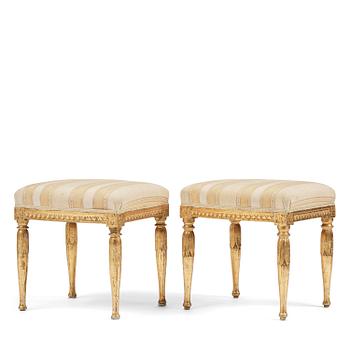 85. A near pair of late Gustavian giltwood stools, one by J. Hammarström (master in Stockholm 1794-1812).