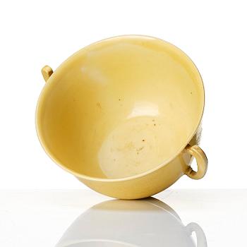 An imperial yellow glazed two handled wine cup, Qing dynasty, Kangxi mark and of the period (1662-1722).