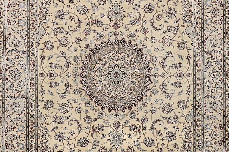 A Nain carpet, part silk, 6 laa, signed, c. 295 x 205 cm.