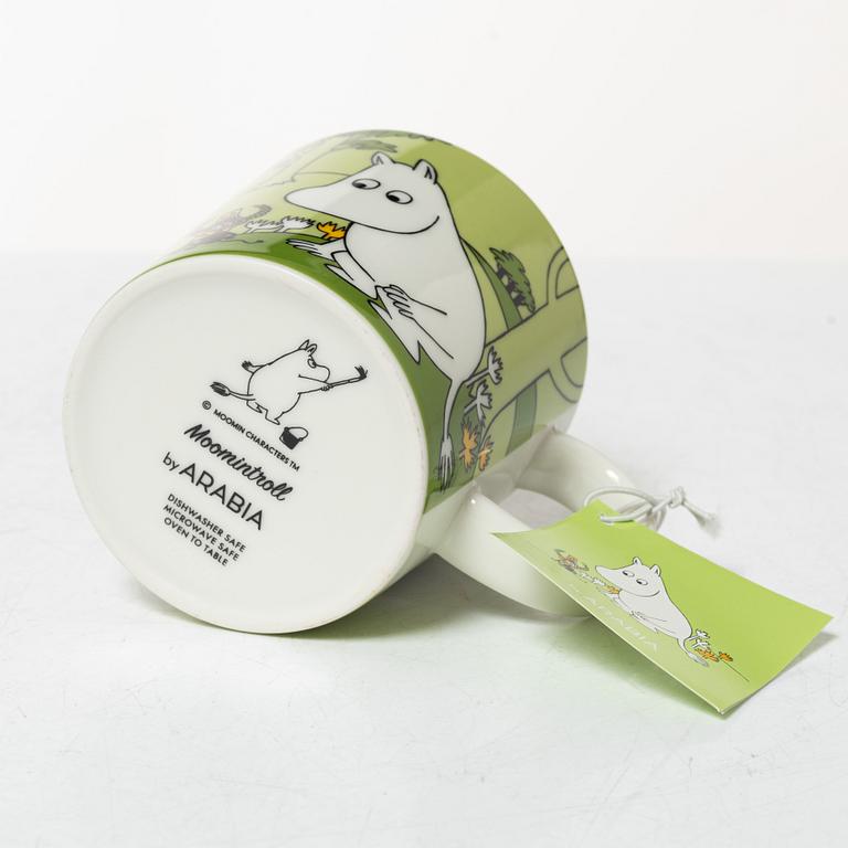 A set of 24 Moomin mugs, Arabia, Finland.